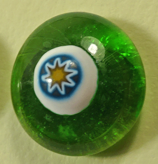 Green glass capped with blue and white star