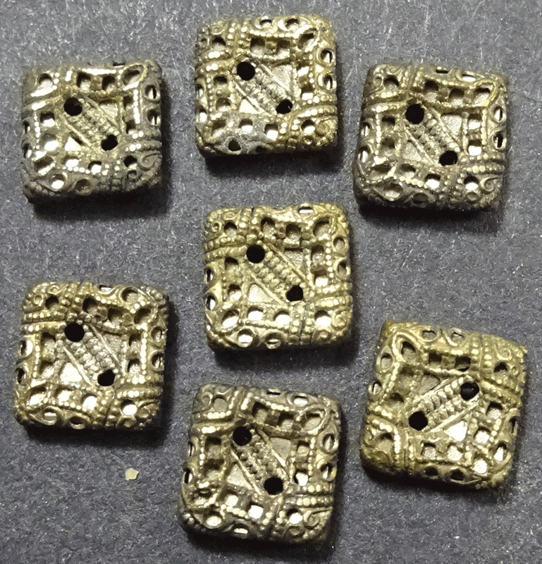 st672-set-of-7-tiny-pierced-sq-metal.gif