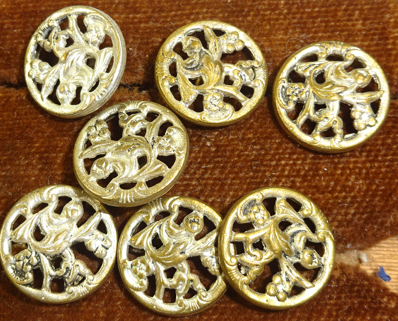 Set of 7 small pierced vintage metal buttons