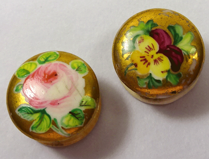 Pair of small ceramic studs, painted flowers