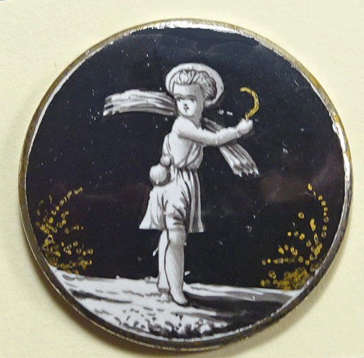 White figure on black enamel, gold highlights