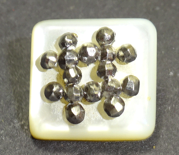 Small rounded square pearl with steel trim