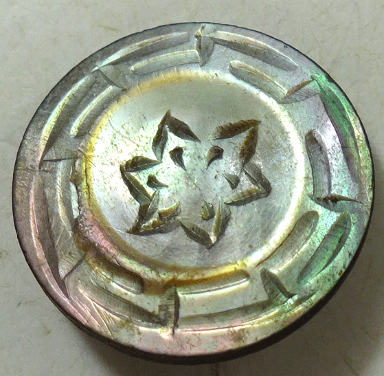 Small mother of pearl with carved star