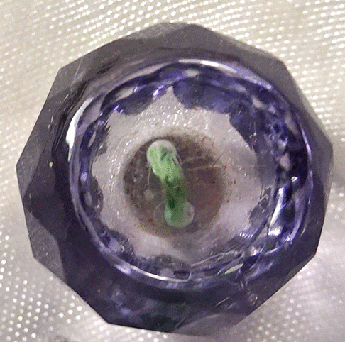 Small mauve facetted glass