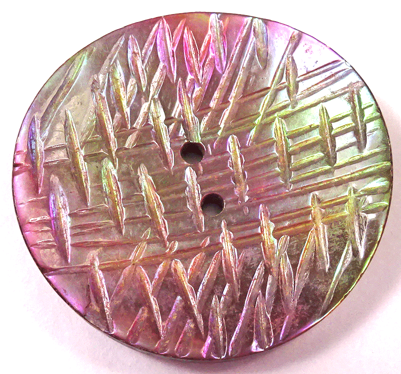 Large iridescent pearl, carved abstract lines
