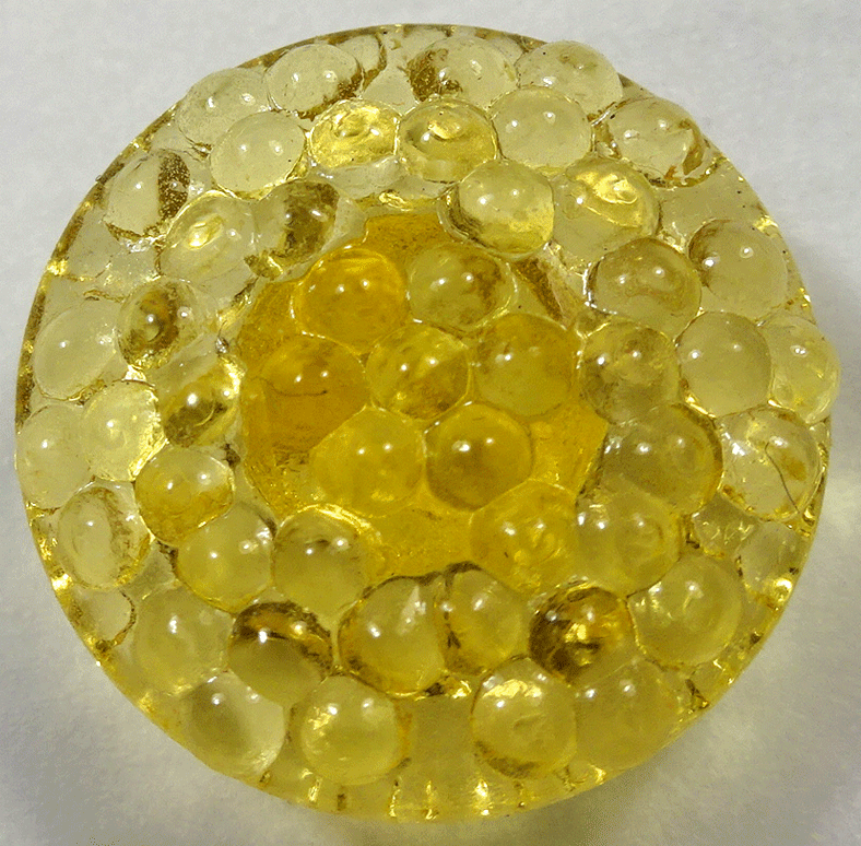 Yellow glass bobble top