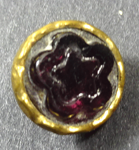 Small purple glass in metal