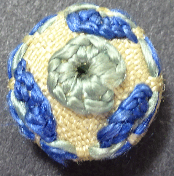 Small blue embroidered buttons