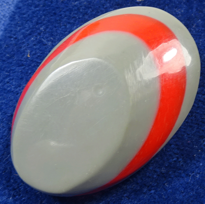 Grey and red laminated oval