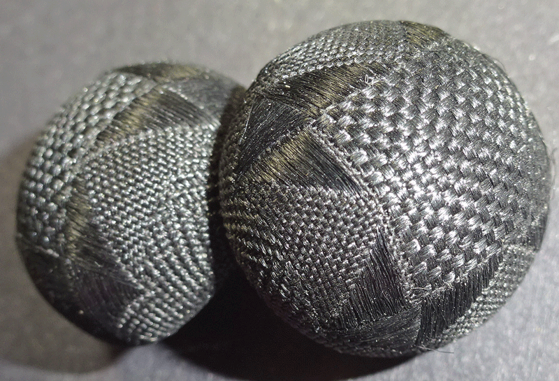 Pair of 2 domed black silk buttons