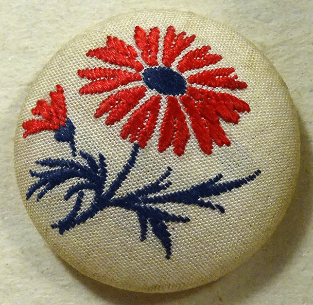 Machine embroidered red flower