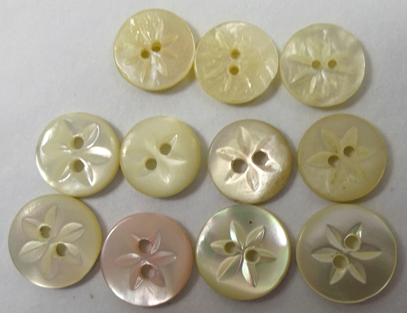 Set of 11 small pearl, carved star design