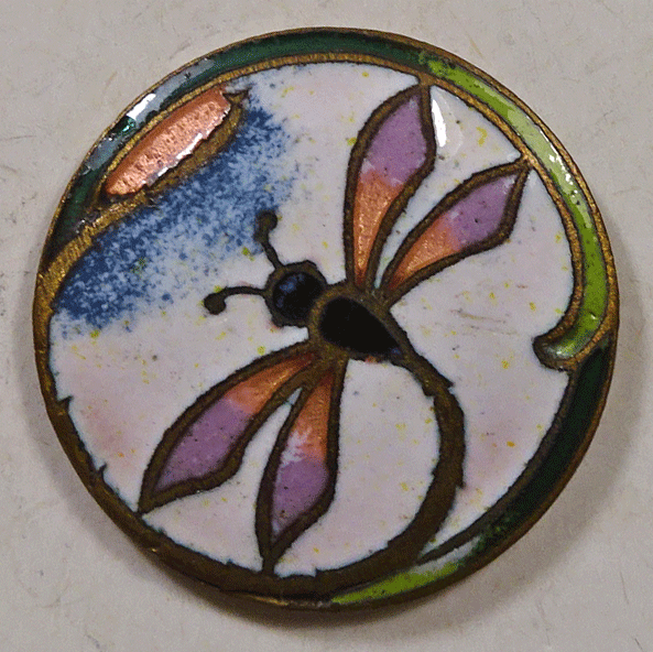 Enamel dragonfly on white background