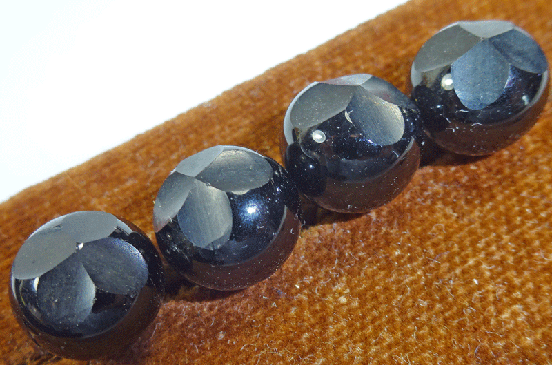 Set of 4 black glass ball with quatrefoil dimple