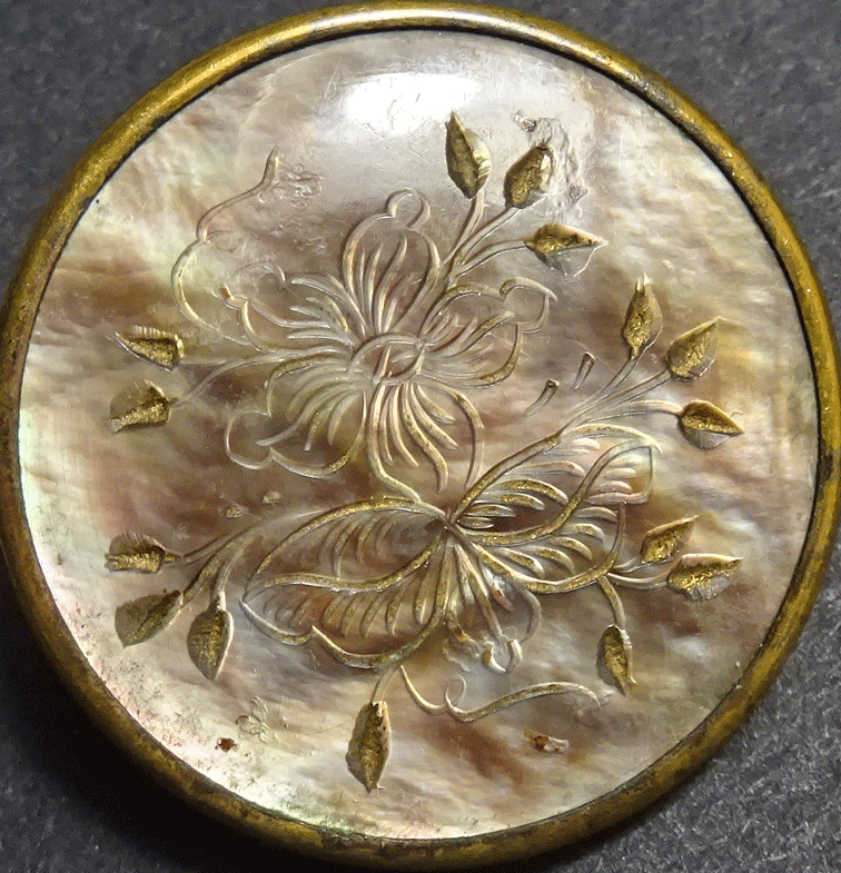 Incised flowers on pearl, in metal frame, Paris back