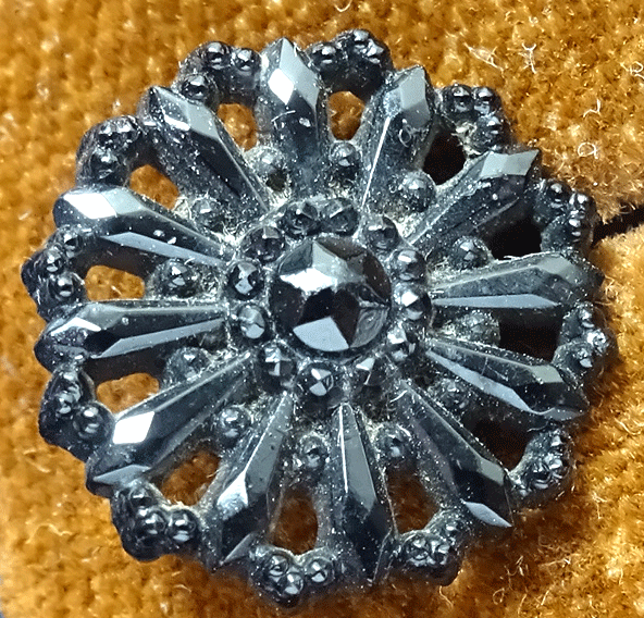 Pierced black glass flower buttons