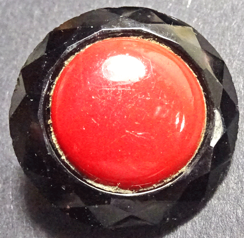 Black glass with red glass centre