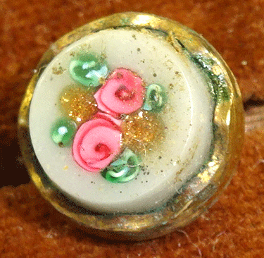 Small white glass with pink roses