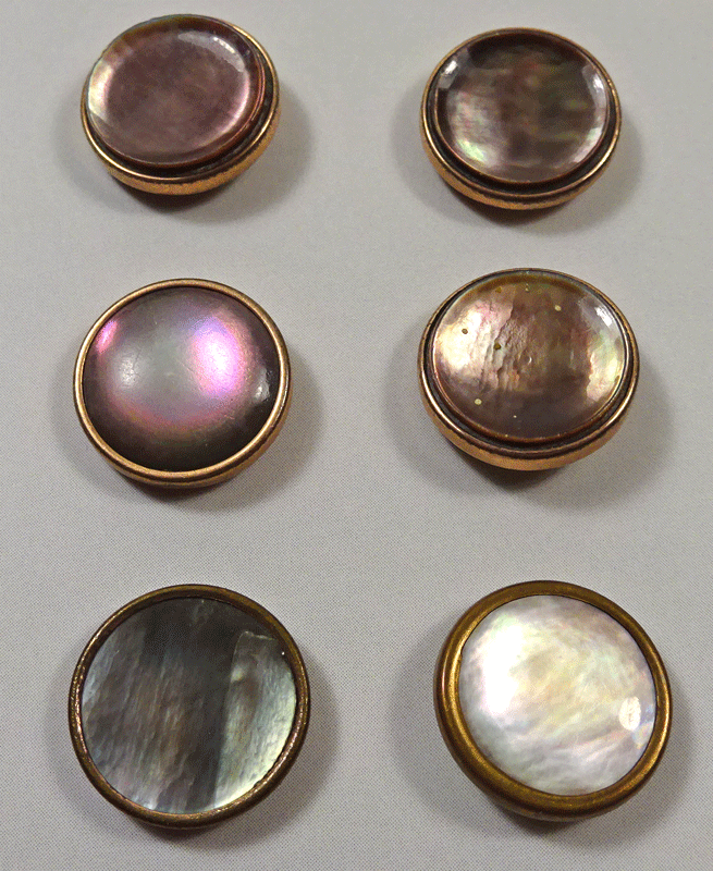 Six pearl dress buttons, metal frames