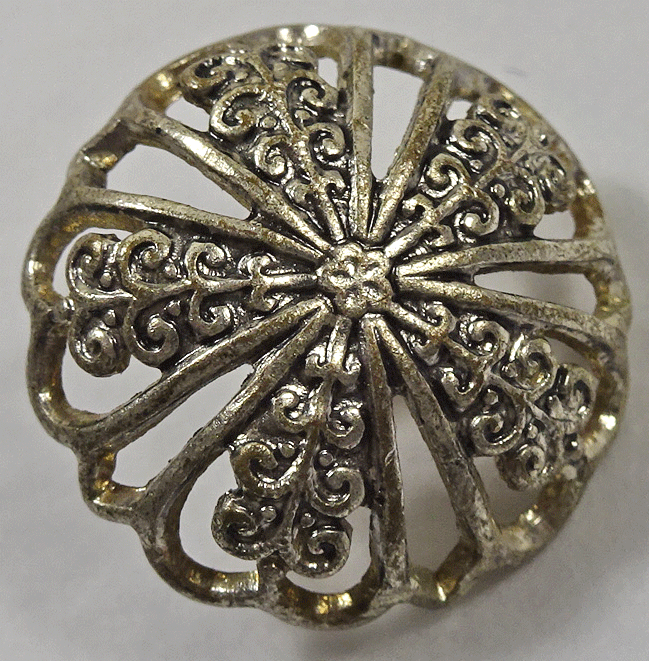 Pierced white metal domed button