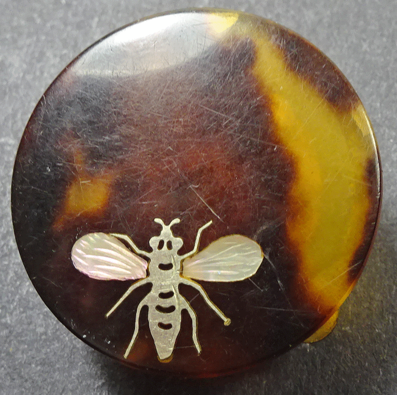 Faux tortoiseshell solitaire, inlaid with insect