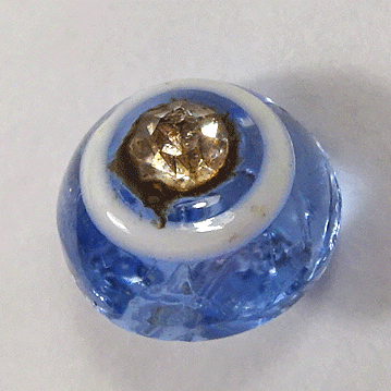 Small pale blue glass with paste