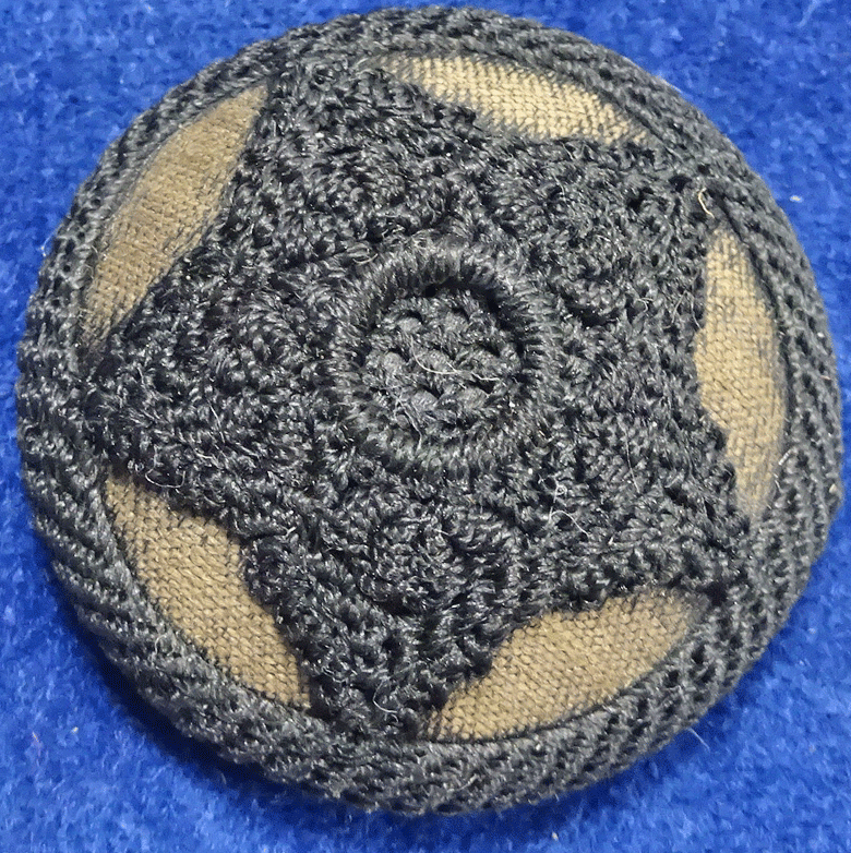 Black star over brown fabric