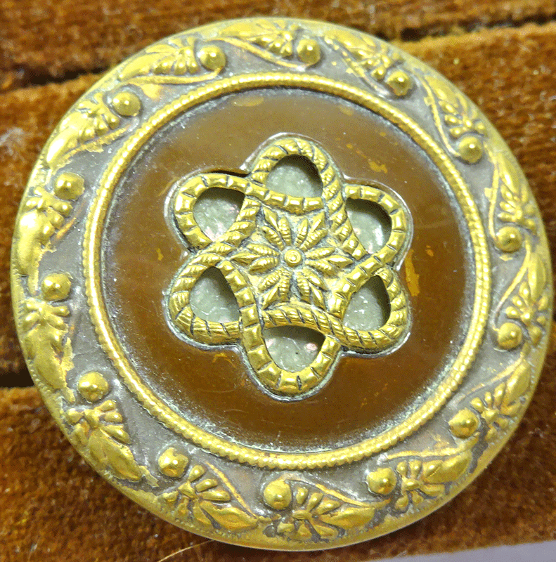 Pressed metal over brown celluloid