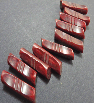 Long narrow dark red cylinder — VINTAGE BUTTON EMPORIUM