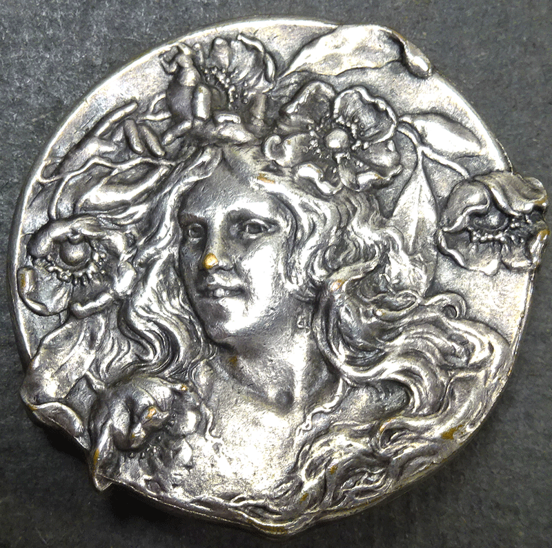 Large vintage female head with flowers in her hair