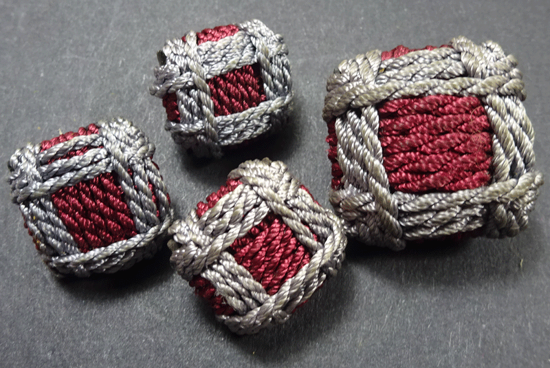 Set of 4 square buttons wound with grey on red cord