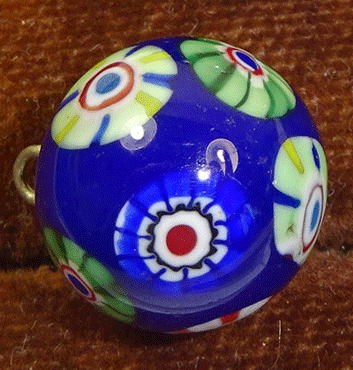 Blue glass waistcoat ball with millefore decoration
