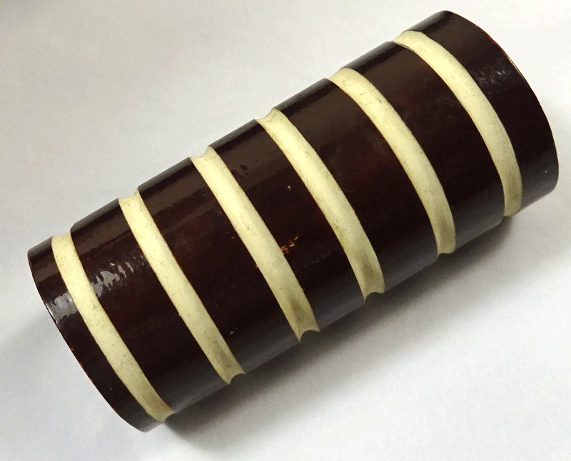Large brown cylinder, cream stripes