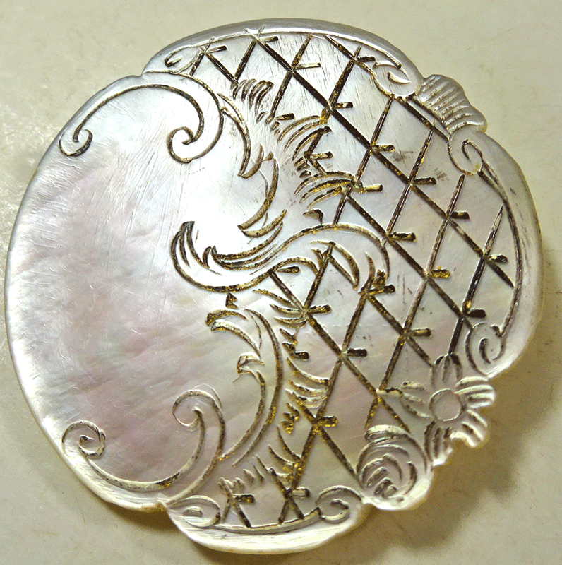 Antique mother of pearl with incised rococo design
