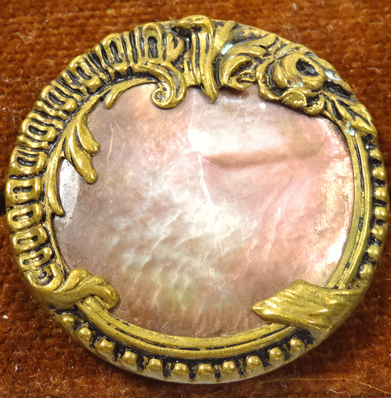 Mother of pearl in pressed metal frame