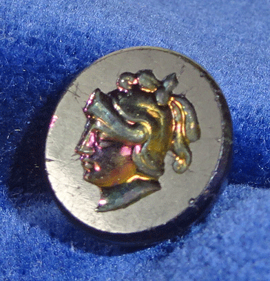 Small black glass with intaglio head