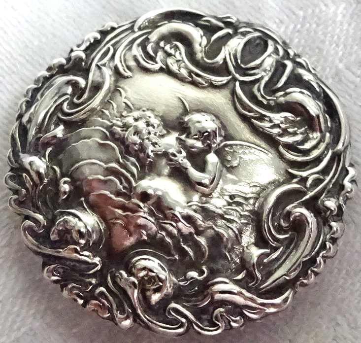 Silver buttons, kissed by a cherub, Birmingham 1902