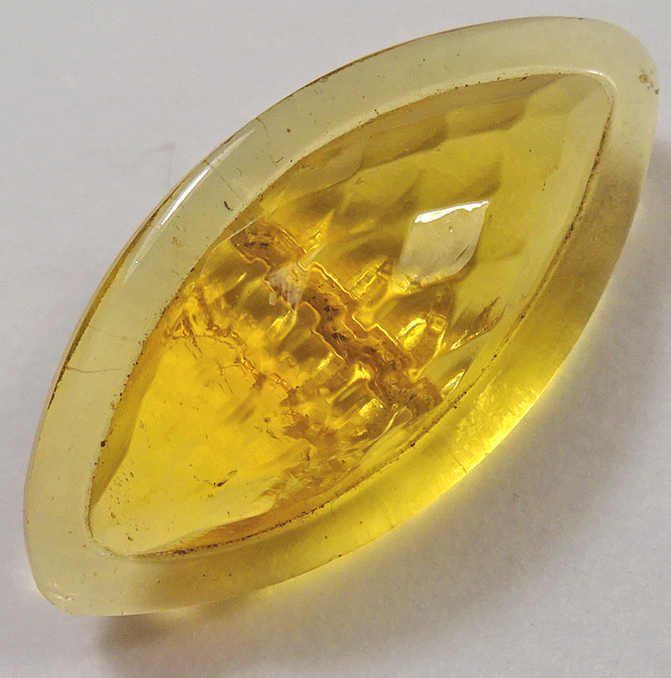 Yellow glass spindle shaped button