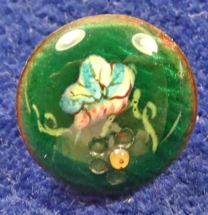 Very small enamel flower button