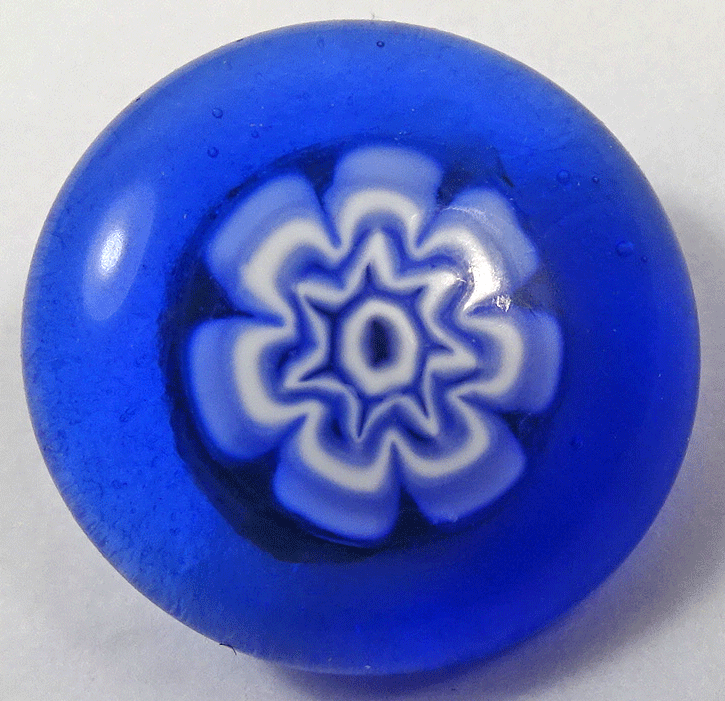 Blue glass with white flower