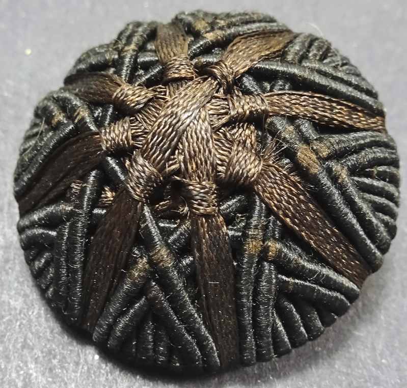 Large woven black cord and brown ribbon