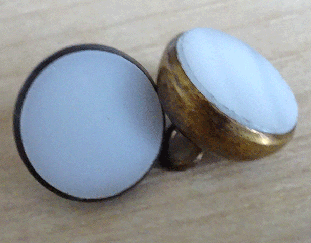 White glass in gilt metal cup