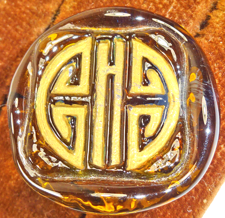 Stamped Greek pattern on toffee glass - Orplid