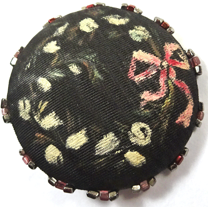 Large black, painted silk covered button