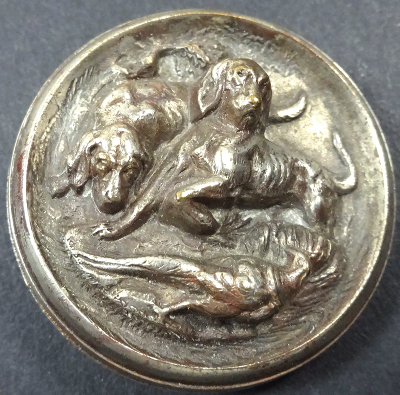 Antique sporting button with hunting dogs in high relief