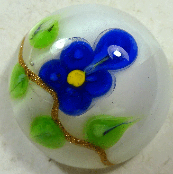 Blue flower on white glass