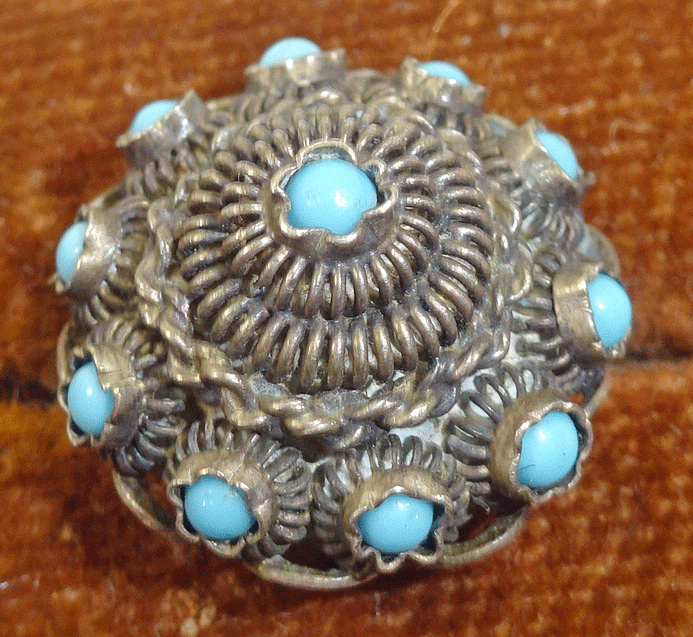 Small filigree buttons embellished with turquoise stones