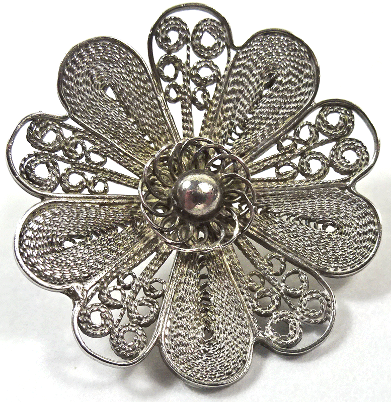 Delicate filigree metal flower