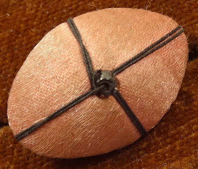 Pink fabric with dark brown cross threads