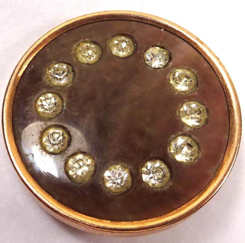 Smokey pearl with paste stones in metal frame